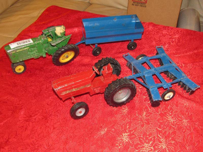 lot 7030 image: Lot of 2 Toy Tractors - John Deere Tractor Metal Toy Replica w Blue Trailer International Tractor w Plow Attachement