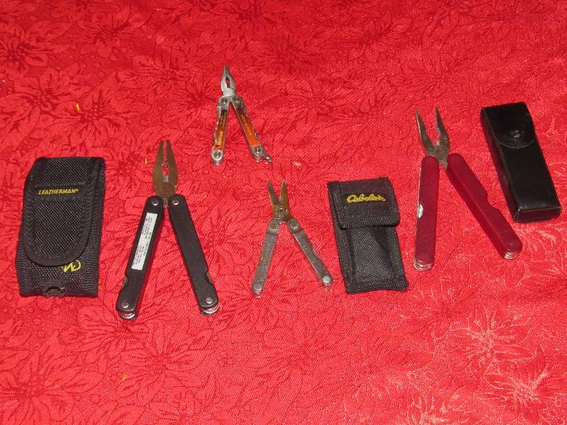 lot 7037 image: Lot 4 Leatherman Multi-Tools - Red, Black, Sheffield and Leatherman - see photos