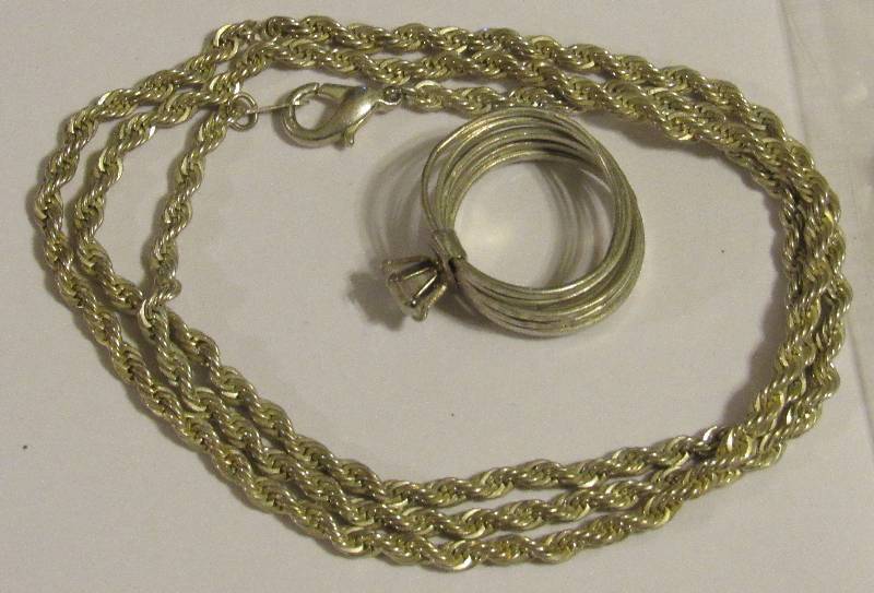 lot 4556 image: Silver Necklace & Silver Ring marked 925 necklace is broken - total weight 19.3gr