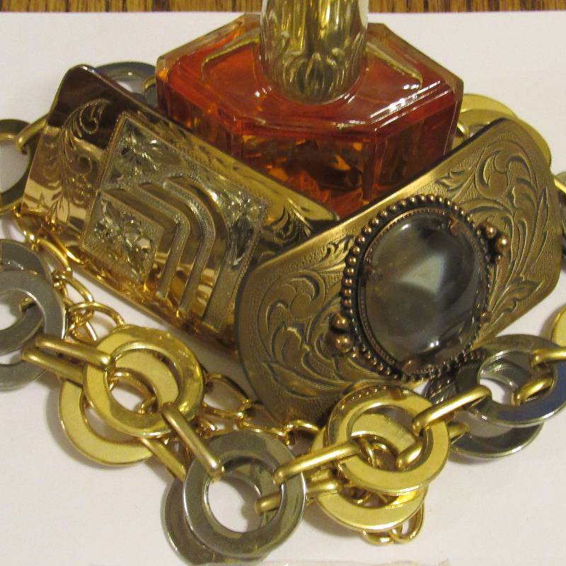 lot 4561 image: Lot of Fashion Accessories - Ceasers Perfume, Belt (), 2 Cool Belt Buckles
