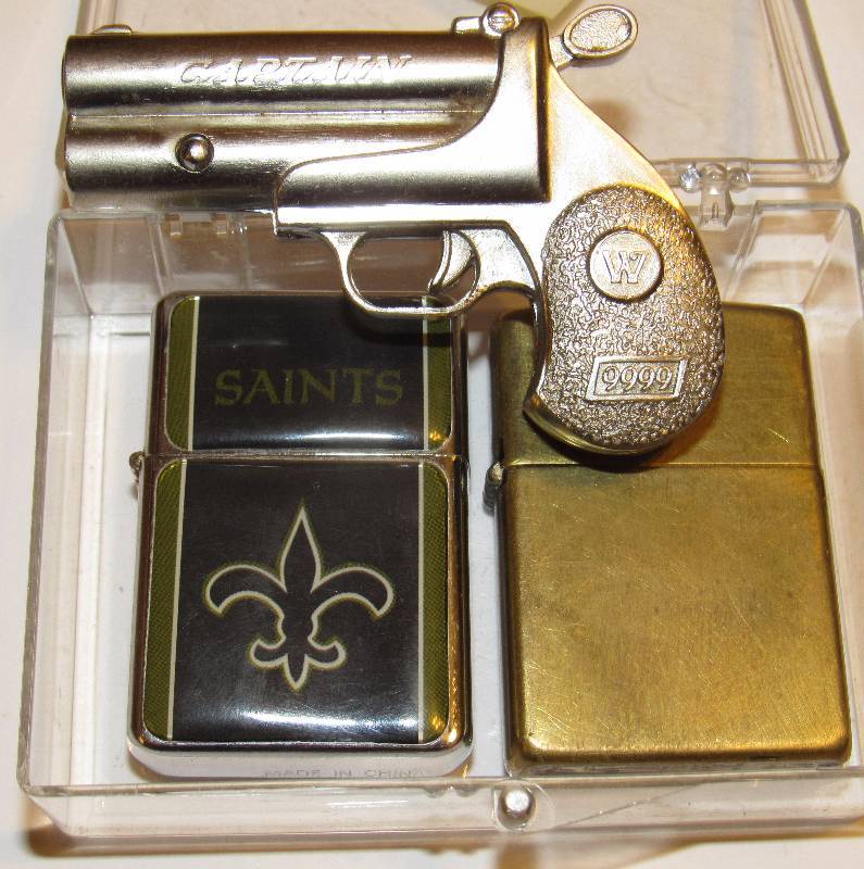 lot 4565 image: Lot of 3 Cigarette Lighters - 2 Zippos and One Replica Handgun - see photos
