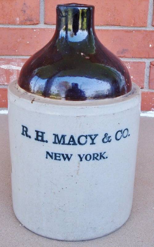 lot 1094 image: Historic New York Mercantile Stone Ware Jug R.H. Macy - 1st NYC Liquor Licensee - Wow