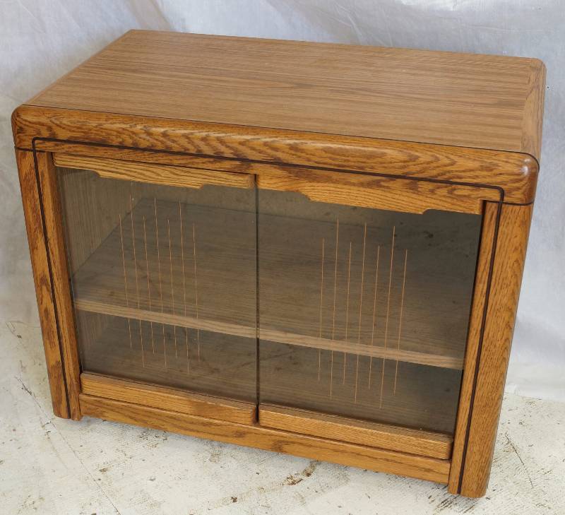 lot 1156 image: Very nice Wooden TV  Media Cabinet - Class Front, One adjustable Shelf - On Casters - NICE (see photo for measurements)