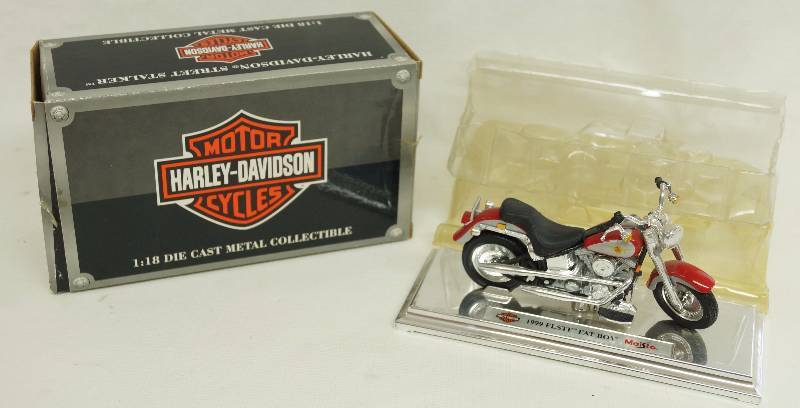 lot 1249 image: HARLEY-DAVIDSON MOTORCYCLES - 1999 FLSTF FAT BOY  - Maisto 118 Die Cast Metal Replica Model - with box