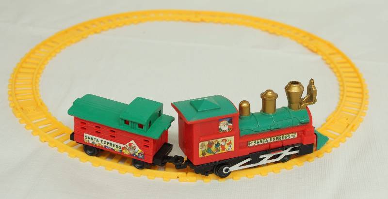 lot 4797 image: Tiny Toy Train - Christmas SANTA EXPRESS - track comes apart. Engine, caboose and track