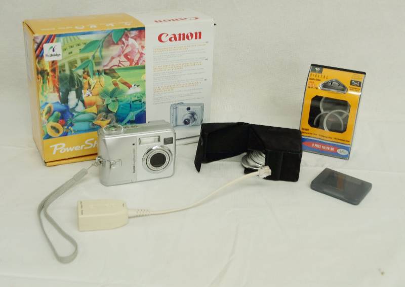 lot 6174 image: Kodak Easy Share Camera, papers and extra lens filters - not in original box. Box is for Canon