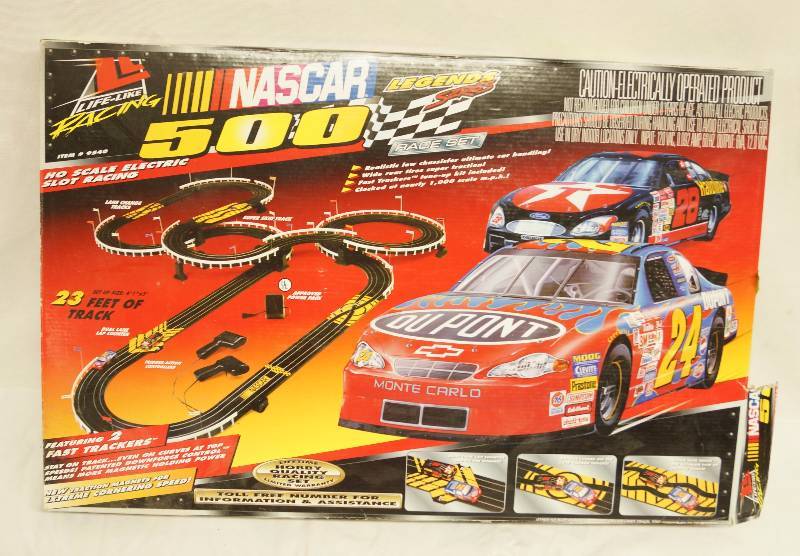 lot 6297 image: Nascar Legends Series 500 HO Scale Electric Slot Racing Track in Box - Win the Race