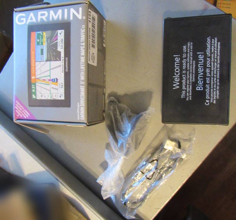 lot 4144 image: Garmin 5 GPS Navigator - Never Used w original box & Instructions