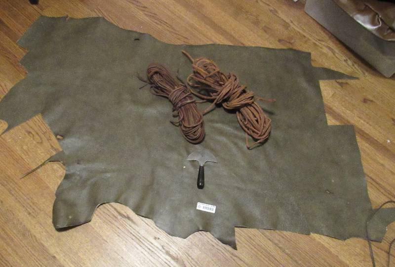 lot 4189 image: Brown Upholstery Piece - 2 Brown Leather RopesStraps & C.S. Osborne & Co. Tool