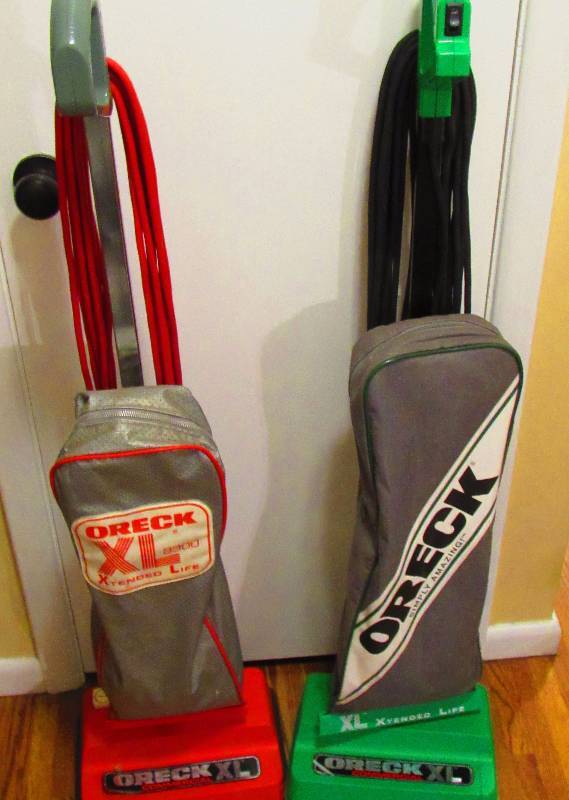 lot 4212 image: 2 Oreck XL Vacuum Cleaners - Commercial Use - 1 Green (works) & 1 Red (for parts only)