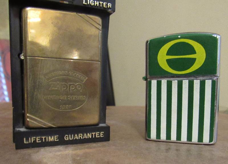 lot 4028 image: Lot of 2 Lighters - Zippo Vintage Series 1937 in black Case - Penguin brand - see photos