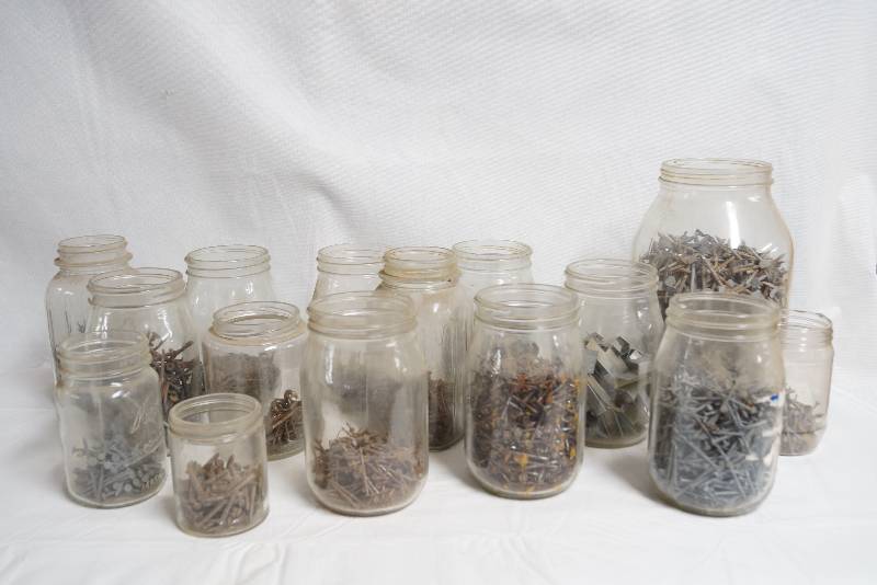 lot 2124 image: Assorted Nails, Staples, and More All in Mason Jars See Pictures