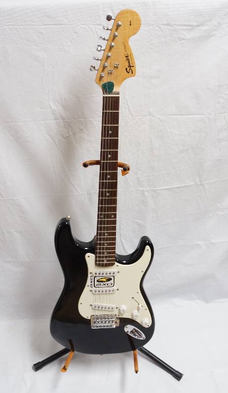 lot 2167 image: Fender Squire SSS Black Electric Guitar w Guitar Bag and Stand- WOW Includes Tuner, Manual, Cord and some extra strings