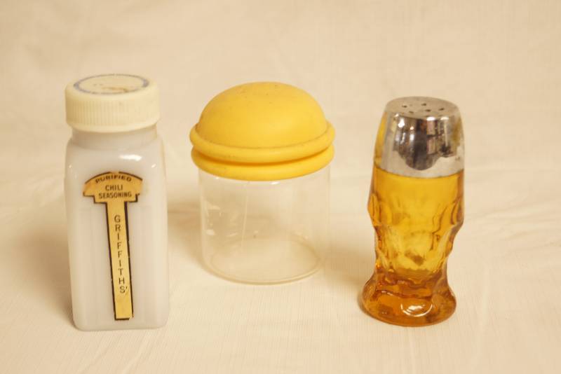 lot 2540 image: Griffiths Chili Seasoning container, Salt Shaker and container - see pics