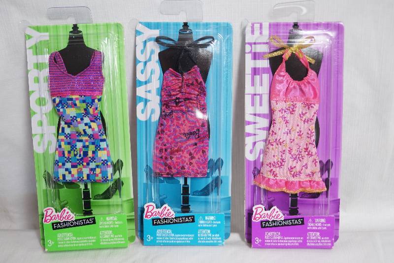 lot 2078 image: Lot of 3 Barbie Outfits - New in the packages Fashionistas