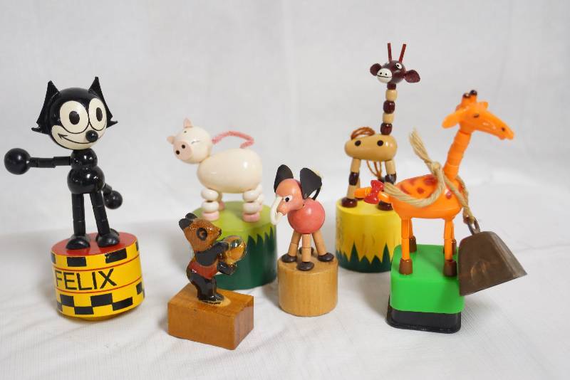 lot 2077 image: Lot of 7 Collapsing Toys, wood pencil sharpener and a bell FELIX the Cat and more See Photo