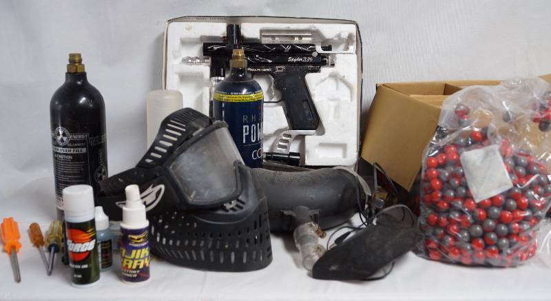 lot 2199 image: Nice Lot of a Paint Ball Gun, Paint Balls, Mask, Supplies and More See Photos