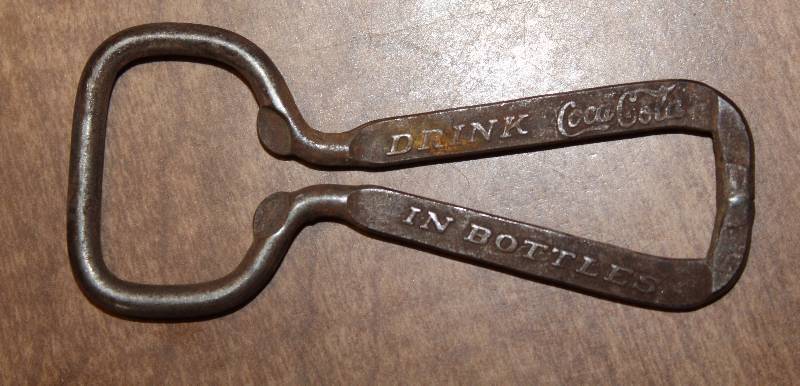 lot 3124 image: Old Coca Cola Bottle Opener - WOW