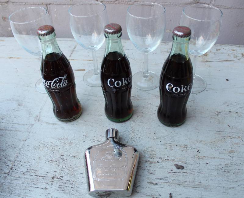 lot 3173 image: Lot of 4 Glasses, 3 Coke Bottles (unopened) and Crown Royal Flask - WOW