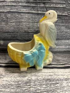 lot 32 image: vintage Shawnee stork, nursery rhyme pottery planter