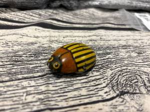 lot 198 image: Antique potato bug toy