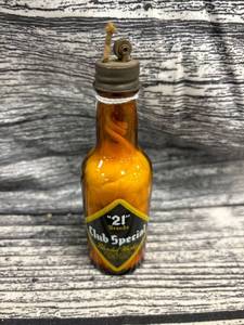 lot 253 image: Vintage 21 brands club, special blended whiskey bottle, lighter