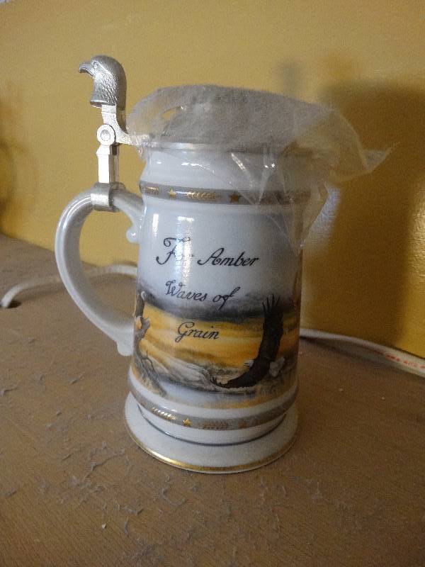 lot 673 image: America the Beautiful series- Amber waves beer stein