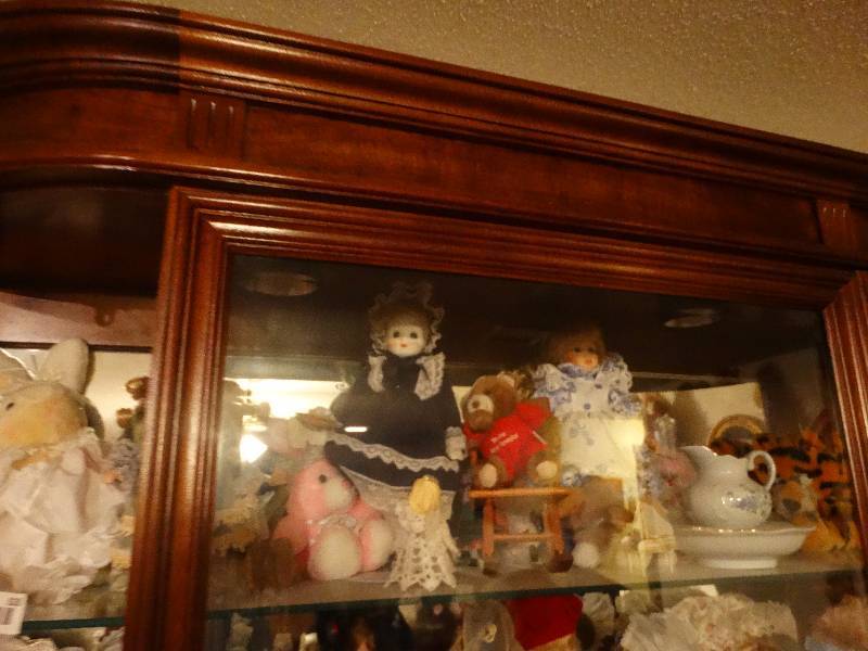 lot 828 image: Top Shelf - Dolls (4), Stuffed Animals, Tea cup w Saucer, & Baby Angel
