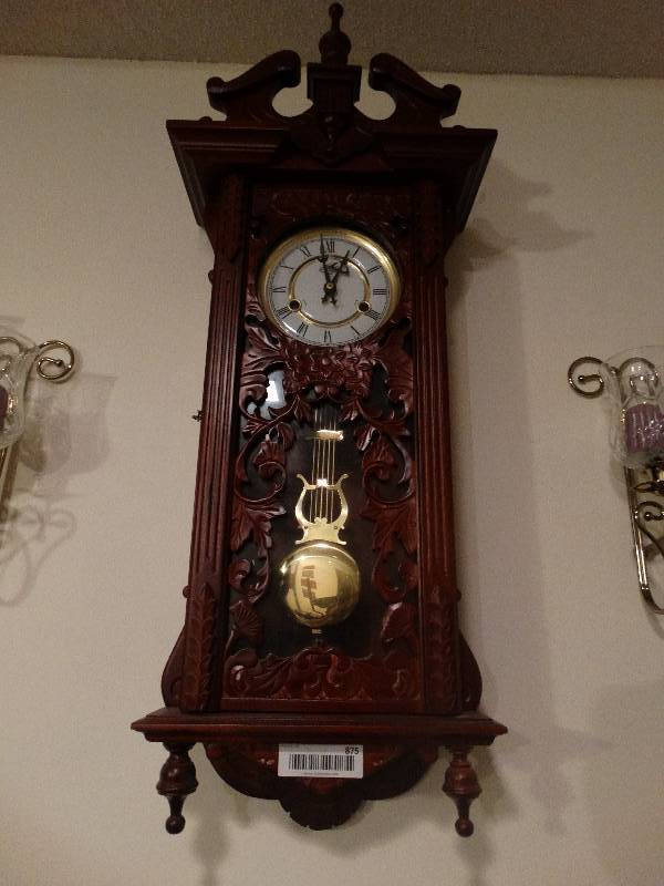 lot 875 image: Intricately carved Wall Clock - Wood w Key