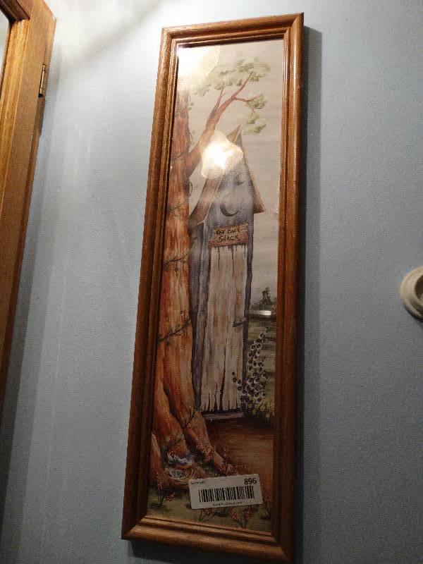 lot 896 image: Contents of Basement Bathroom - Framed Art, Soap, Paper Towels, & Wood Stand