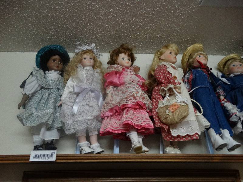 lot 904 image: Wood Wall Shelf, Dolls (7), Wood Shelf & Hanging Doll