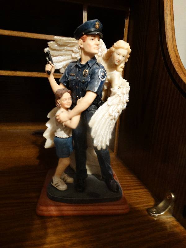 lot 929 image: Police & Angel Statue