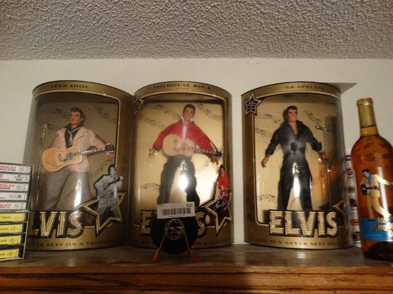 lot 932 image: Collectible Elvis Items - 3 Dolls in box, Mini Records, Cassette Tapes, & Bottle