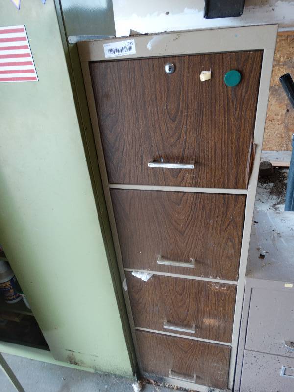 lot 985 image: 4 drawer file cabinet w contents- Lots of nails, screws, hardware