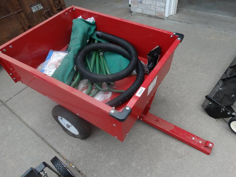 lot 1656 image: Pull behind 10 cubic foot dump trailer for riding lawn mower w contents.