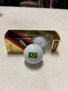 lot 67 image: 3- pinnacle gold agp logo balls