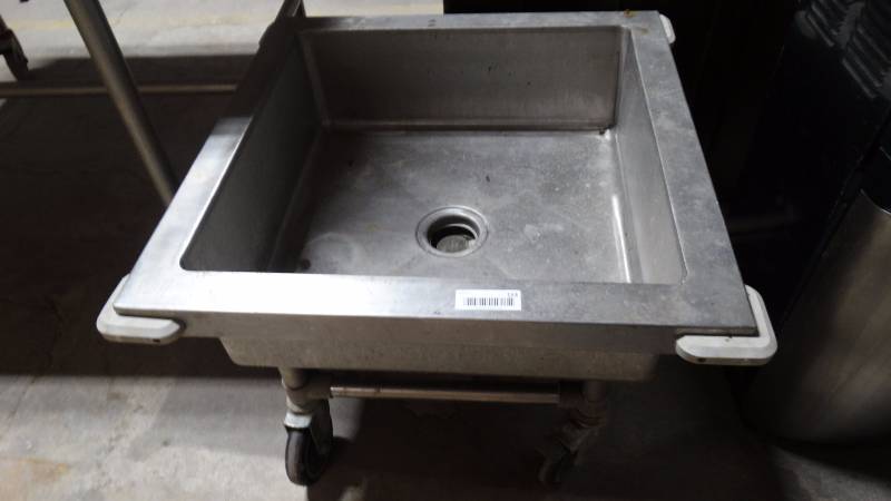 lot 153 image: Stainless portable mop sink w drain on wheels.