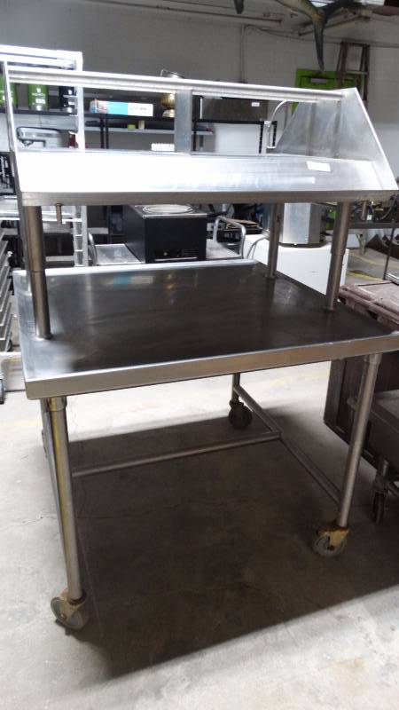 lot 154 image: Stainless double sided preparation table w over shelf on both sides