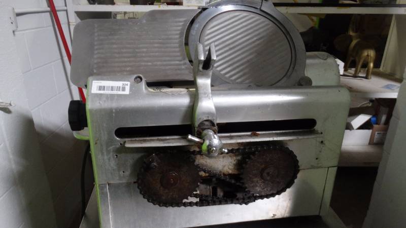 lot 304 image: Globe commercial meatcheese slicer w sharpener.