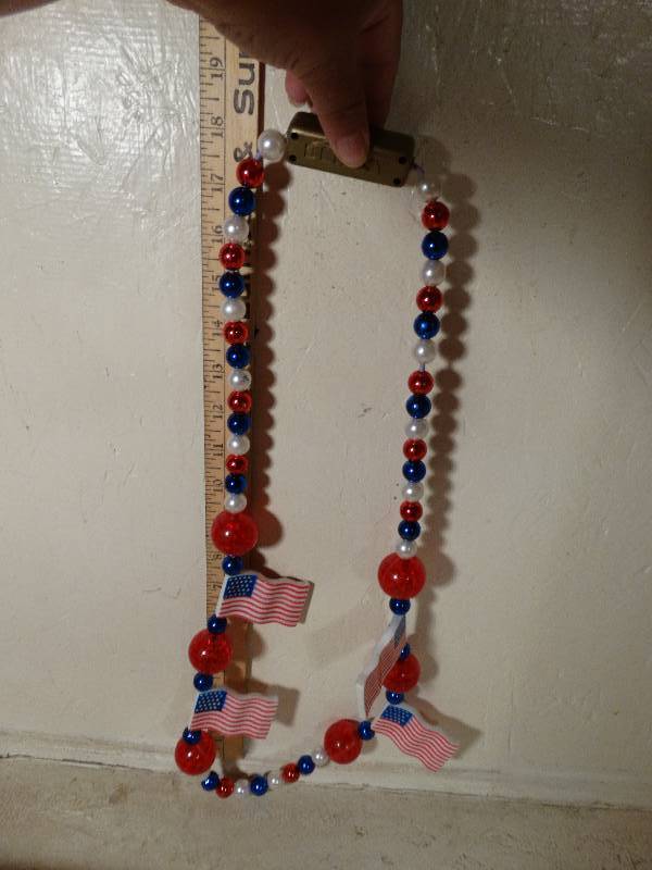 lot 105 image: Assorted Holiday necklaces.