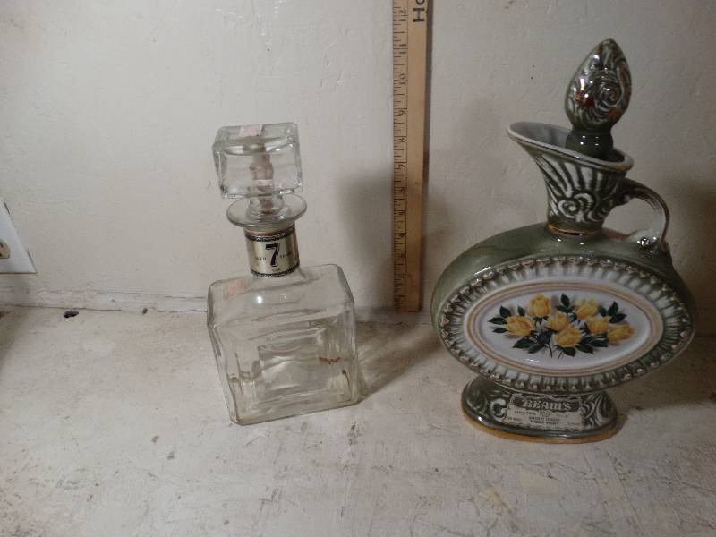 lot 136 image: Whisky bottle and Beams decanter.