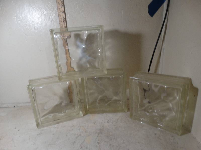 lot 167 image: Four glass blocks.