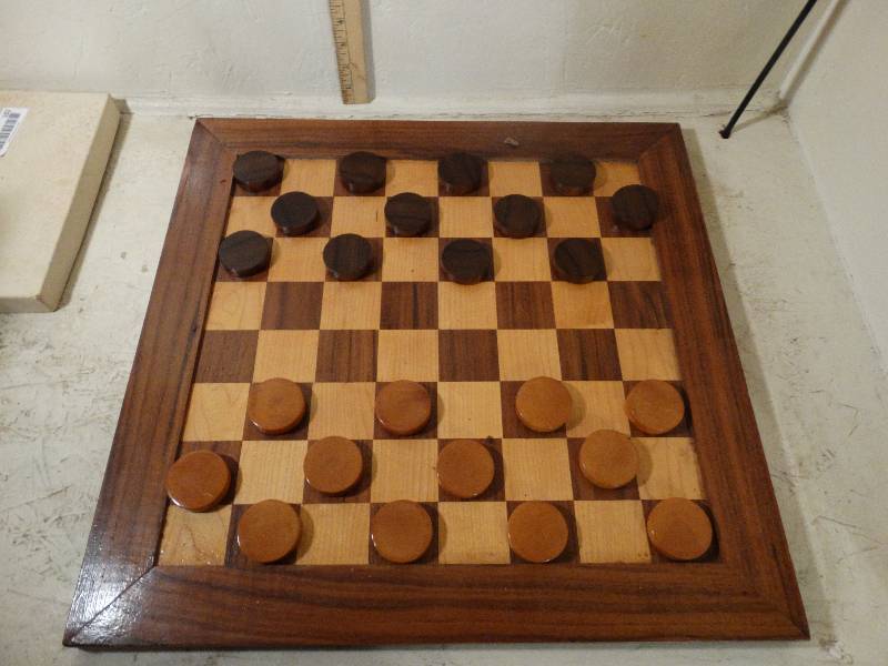 lot 192 image: Wooden game board w wooden checkers.