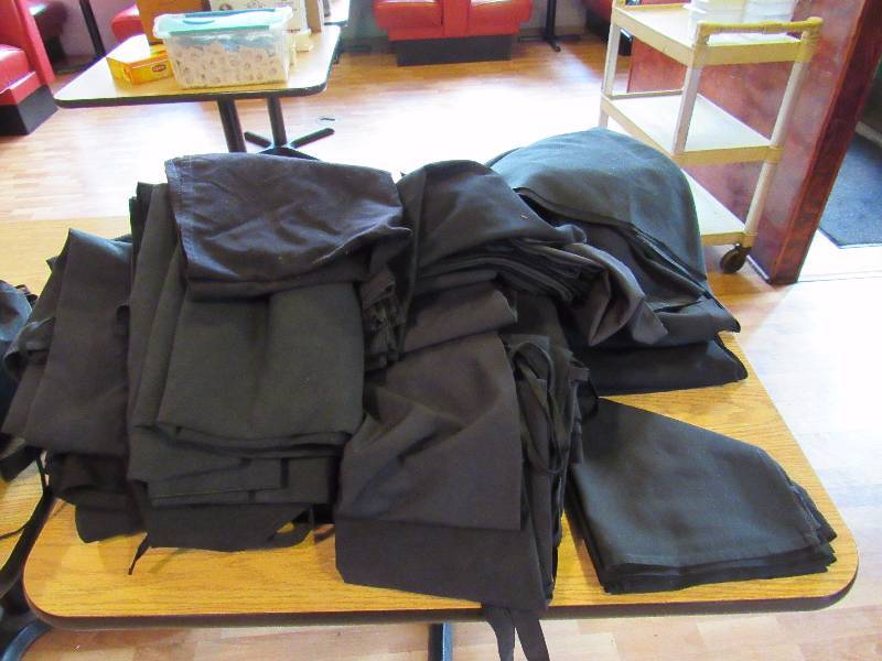 lot 4953 image: Large Lot Of Black Napkins, Aprins, And Table Clothes