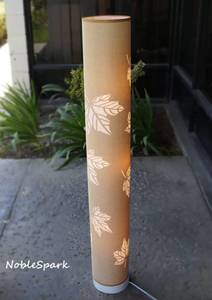 lot 6474 image: Ebern Designs Braloh 50 Inch Tall Painted Column Floor Lamp - Pink Fabric Shade with Hollow Maple Leaf Pattern
