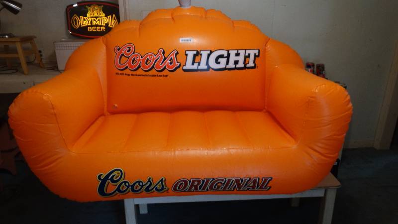 lot 243 image: Coors Inflatable Lake Couch on the water.