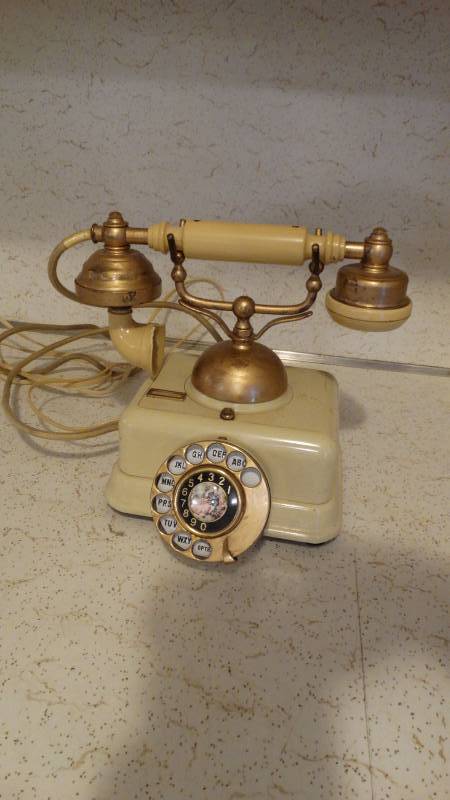 lot 320 image: vintage rotary looking phone
