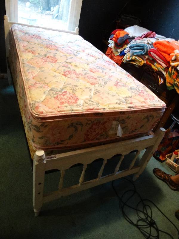 lot 376 image: Twin bed, Wood frame, Double sided pillow top mattress this bed has high clearance under neath.