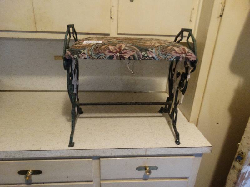 lot 391 image: Cast iron skeleton bench.