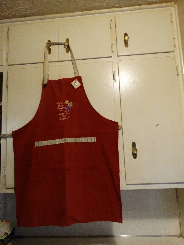lot 431 image: Wine is the answer apron.